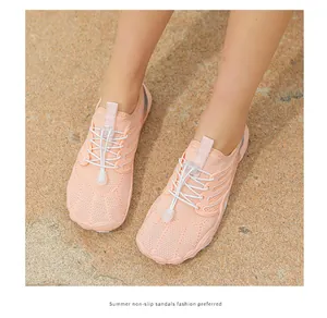 Light pink breathable mesh water shoes with a non-slip sole for beach and wading
