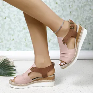 Close-up of pink wedge peep-toe sandals with espadrille rope sole and ankle strap