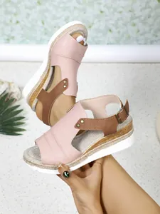 Detail of pink and brown wedge sandals with decorative jute rope platform sole