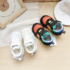 Detailed view of children's gradient mesh sneakers with velcro straps and rainbow colors