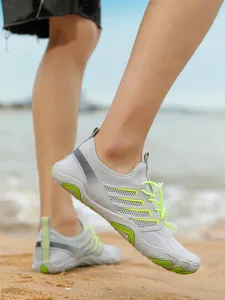 Lightweight grey and neon green quick-dry water shoes for beach and swimming activities