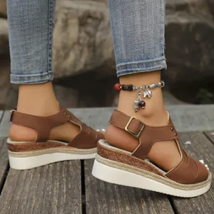 Brown peep-toe wedge sandals with braided rope sole and adjustable ankle strap