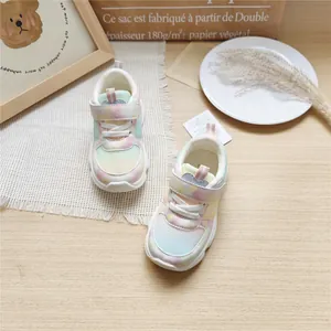 Detailed view of pastel gradient mesh sneakers for children in lifestyle setting
