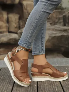 Detailed view of brown women's wedge sandals with peep toe and jute rope platform sole.