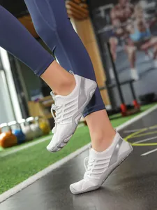 Lightweight white breathable non-slip water shoes for swimming yoga and fitness activities.