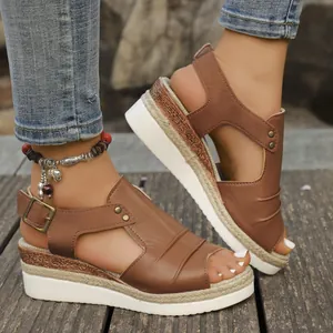 Stylish brown platform wedge sandals featuring espadrille rope sole and peep toe details