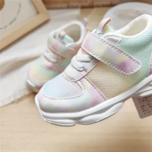 Close-up of kids' breathable mesh sneakers with colorful gradient pastel pattern