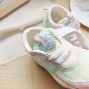 Detail view of breathable pastel gradient mesh sneakers for kids with heart patch