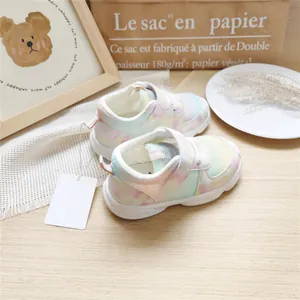Close-up of pastel gradient mesh sneakers for toddlers with hook-and-loop straps.