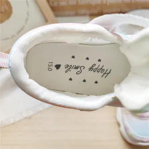 Close-up detail of children's gradient mesh sneaker insole featuring Happy Smile print
