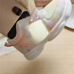 Detail view of children's gradient mesh sneaker showing breathable fabric and interior.