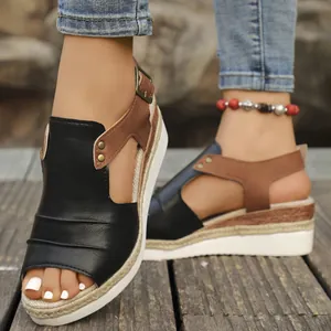 High-quality close-up of women's black and brown wedge sandals with espadrille jute rope soles.