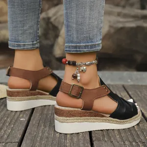 Close-up of women's wedge sandals with fish mouth design and hemp rope sole