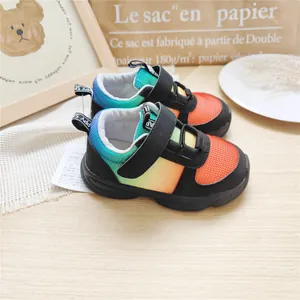 Detailed view of children's gradient mesh sneakers with breathable fabric and velcro straps