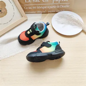 Detailed top view of rainbow gradient mesh children's sneakers with Velcro strap