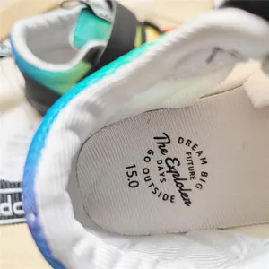 Detail of the soft insole and inner lining in a child's blue gradient mesh sneaker