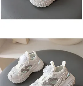 Macro detail of breathable mesh upper and dial closure on beige kids summer shoes