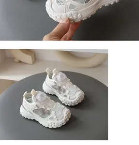 Close-up of white breathable mesh kids sandals with non-slip soft sole