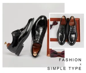Macro view of black leather brogue shoes with elegant decorative wingtip patterns