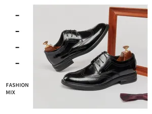 Classic black genuine leather wingtip Brogue shoes for men with ornate carving details