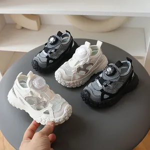 Close-up of breathable hollow mesh and rotary buckle on children's summer sandals