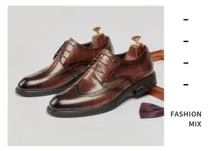 Men's brown leather brogue shoes with classic wingtip carving details for business.