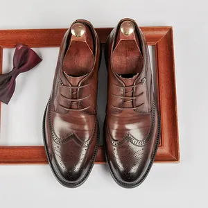 Elegant brown leather Brogue Derby shoes with wingtip detailing for formal business wear