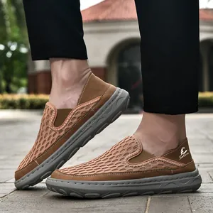 Close-up of men's breathable brown mesh slip-on leisure shoes with thick grey rubber soles