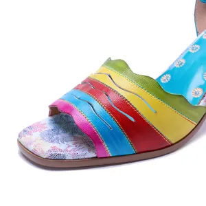 Detailed macro view of handmade colorful leather sandals with intricate stitching