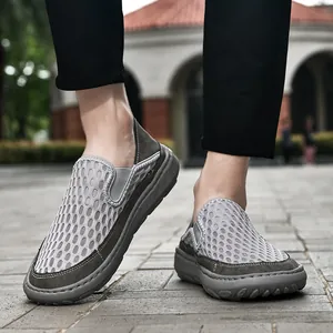 Close-up view of men's summer breathable mesh slip-on loafers in grey and olive green