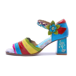 Detail of handmade colorful leather high-heeled sandals with vintage floral patterns