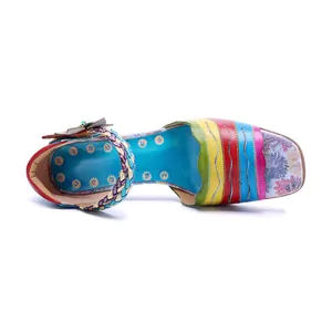 Top view of colorful hand-painted genuine leather sandals with vibrant striped design.