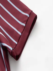 Close-up detail showing the striped sleeve and stitching of a maroon men's sport polo shirt.