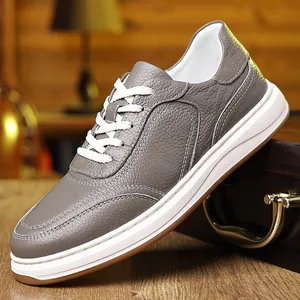 Macro view showing the fine grain texture of premium grey leather men's shoes.