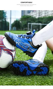 Close-up of children's blue soccer shoes with rotary buckle and turf studs