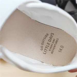 Close-up of breathable insole and interior detail of white toddler sports sandal