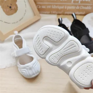 Detailed macro view showing the non-slip sole texture of white children's sports sandals