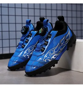 Close-up of blue children's turf soccer shoes with rotating buckle closure