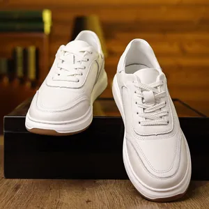 Macro view of stylish white textured leather men's sneakers on a warm wooden background