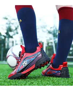 Scarpe da calcio professionali rosse e nere per bambini con sistema di chiusura a disco