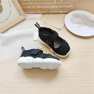 Breathable black mesh children's sports sandals with thick white soles.