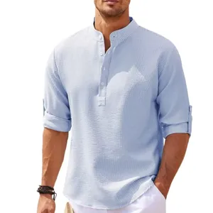 Detailed view of light blue men's waffle texture shirt with stand collar design