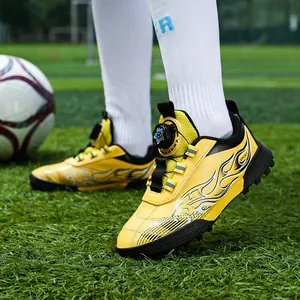 Kids yellow turf soccer shoes with flame pattern and rotary buckle lacing system