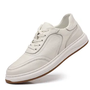 Side view showing the premium pebbled leather texture and stitching of white men's sneakers