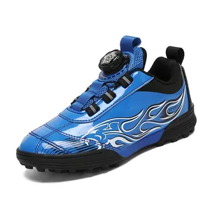 Kids blue turf soccer shoes with rotary dial laces and flame pattern for outdoor training