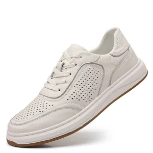 Close-up of white breathable leather sneakers for men with premium stitching detail