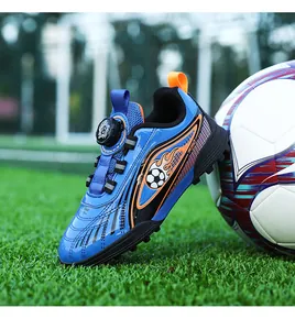 Scarpe da calcio blu per bambini con fibbia rotante e suola per erba sintetica