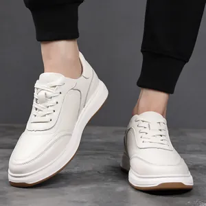 Close-up of white genuine leather men's casual sneakers showing texture and laces