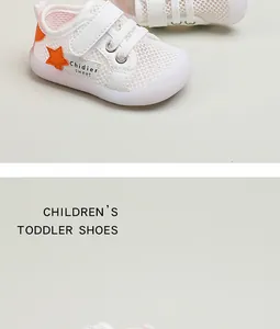 Nahaufnahme der atmungsaktiven weißen Mesh-Lauflernschuhe mit einem orangenen Stern