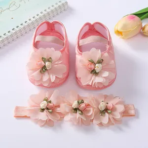 Pink floral baby shoes set with soft soles and a matching flower headband for girls